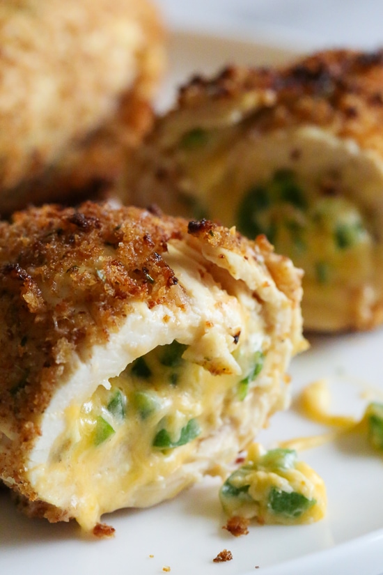 What happens when you combine Baked Jalapeño Poppers with chicken?? Oh yeah baby!! Cheesy stuffed chicken breast stuffed with diced jalapeño, cream cheese, cheddar jack cheese, scallions and bacon!