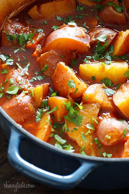 This braised brisket recipe is slow cooked in the oven with potatoes, carrots and onions. Slicing it half-way through makes it extra tender! Dutch oven with braised beef brisket, potatoes, and carrots.
