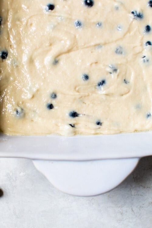 Blueberry cake batter in cake pan.