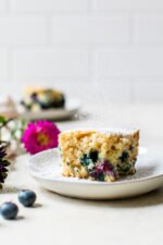 A slice of Blueberry Buttermilk Cake on a plate.