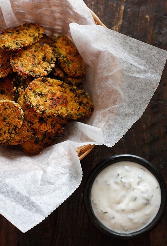 Cornmeal panko herb crusted dill pickles baked in the oven until golden and crisp with a light buttermilk ranch dip. Have you ever had fried pickles?