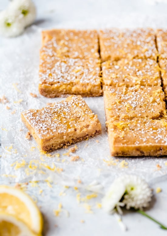 Pucker Up! These sweet and tangy Honey Lemon Bars made with fresh lemon, lemon zest and honey and a whole wheat shortbread crust are a little lighter than traditional lemon bars, but are so tasty and hard to resist.