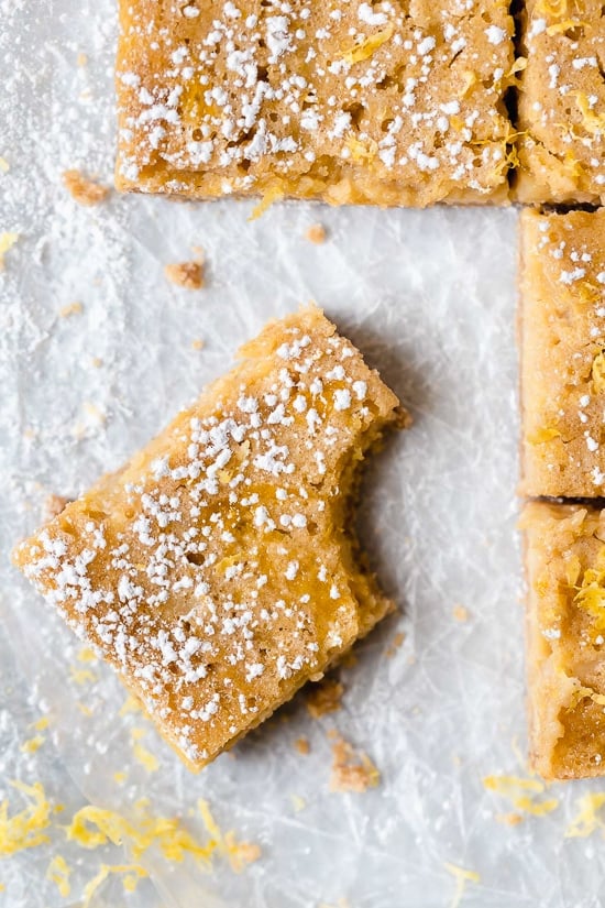 Pucker Up! These sweet and tangy Honey Lemon Bars made with fresh lemon, lemon zest and honey and a whole wheat shortbread crust are a little lighter than traditional lemon bars, but are so tasty and hard to resist.
