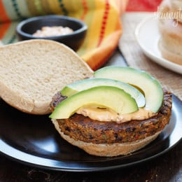 One bite of this spicy black bean burger with spicy chipotle mayo and creamy avocado and you won't miss the meat! Yes, these were good enough to please even the adult carnivore's in my home (a bit too spicy for my kids).
