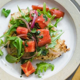 Baked Chicken Milanese is made with breaded chicken cutlets, baked in the oven topped with arugula, tomatoes and balsamic. This is my favorite restaurant dish, made healthier!