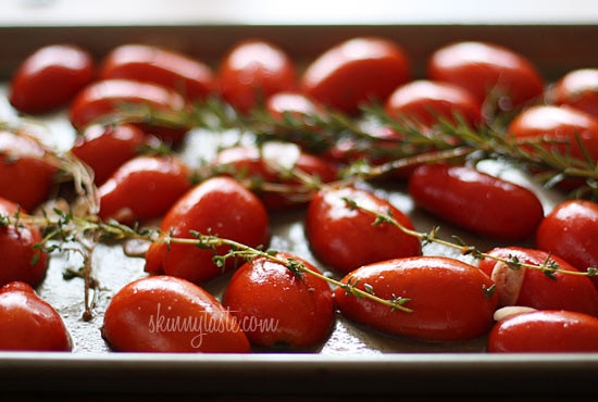 Summer plum tomatoes roasted in the oven with garlic and herbs make an easy, delicious homemade tomato sauce that will fill the room with an intoxicating aroma.