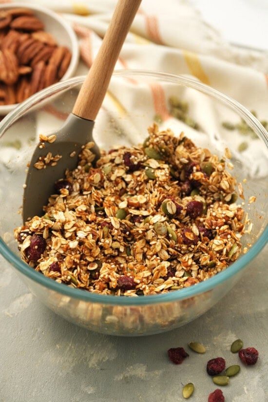 Homemade pumpkin granola with pumpkin, oats, quinoa and flax seed. It's sweetened with maple syrup, has the perfect amount of pumpkin spice! Pumpkin Granola