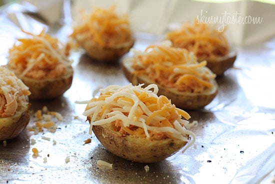 These potato skins are stuffed with shredded buffalo chicken breast made in the crock pot, topped with melted cheese, blue cheese dressing, carrots and celery – they are seriously delicious! What's football without the appetizers.