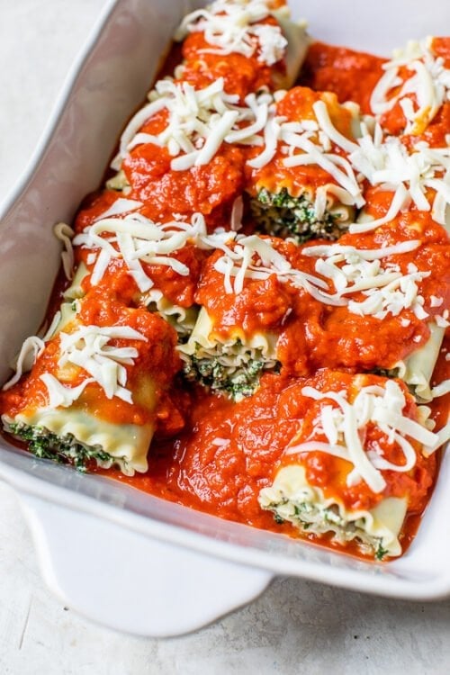 Mushroom Kale Lasagna Rolls in a baking pan.