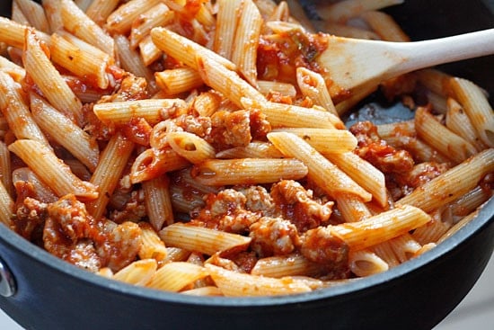 Penne pasta tossed with sauteed brussels sprouts and a quick meat ragu using lean ground turkey and just enough hot Italian pork sausage to enhance the flavor of the sauce. A hearty pasta dish for a crisp Autumn day.