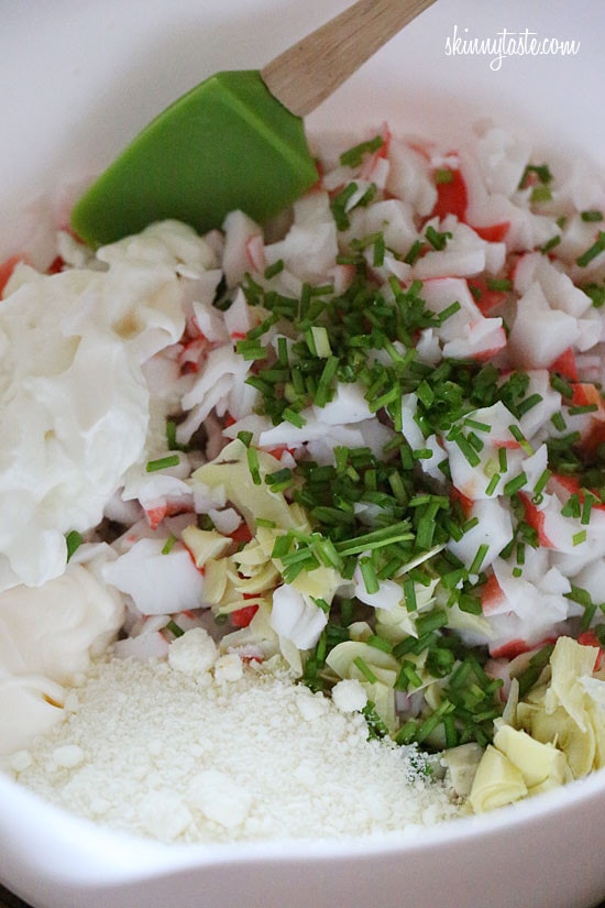 Hot and cheesy imitation crab and artichoke dip is to die for! Serve this glorious dip with baked chips and you will have the perfect appetizer for any party.