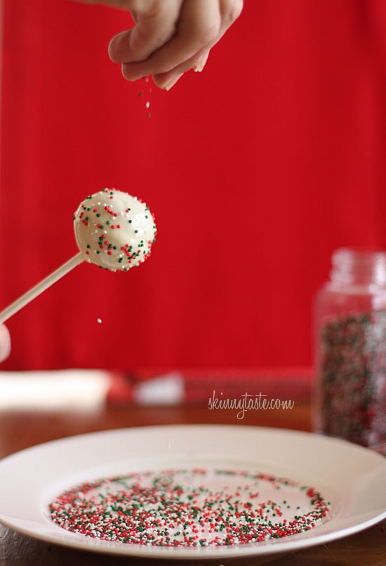 These Skinny Cake pops are made lighter by using a box cake mix, egg whites and fat free Greek yogurt – no oil, no butter required!