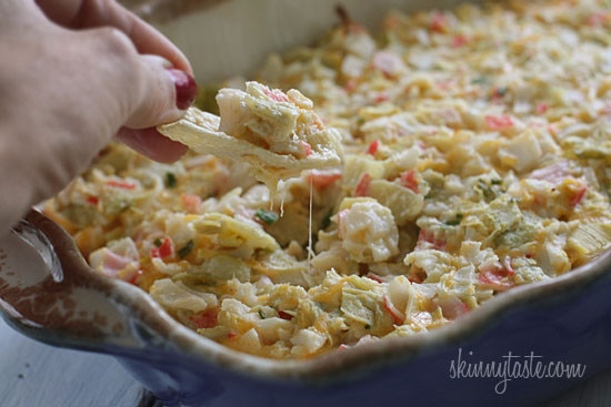 Hot and cheesy imitation crab and artichoke dip is to die for! Serve this glorious dip with baked chips and you will have the perfect appetizer for any party.
