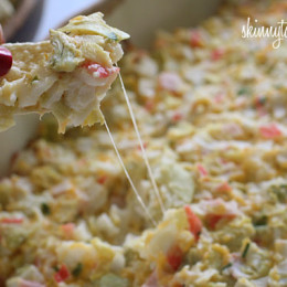 Hot and cheesy imitation crab and artichoke dip is to die for! Serve this glorious dip with baked chips and you will have the perfect appetizer for any party.
