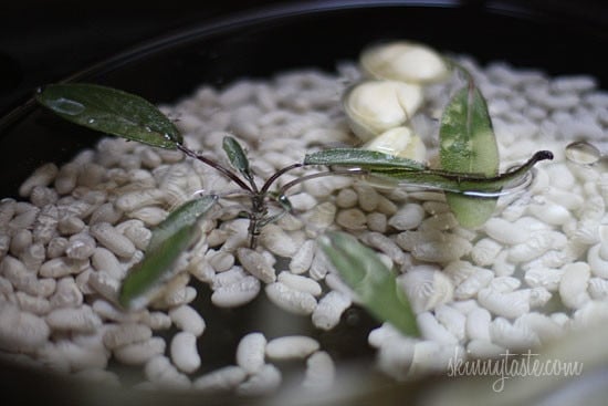 Creamy tuscan white bean soup, with roasted garlic and a touch of sage. So simple and inexpensive to make, and so so good. Leftovers can be frozen.