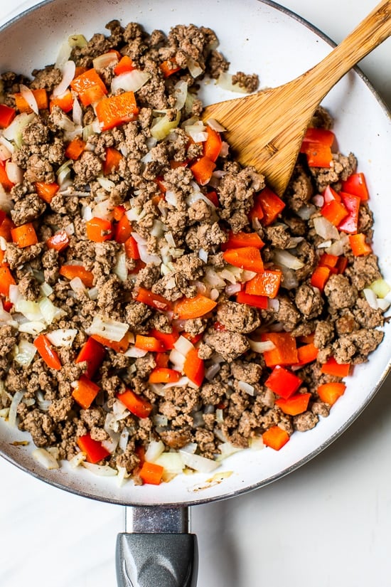 Browning meat in the skillet to make picadillo in the slow cooker.