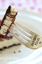 Cheesecake squares, lightened up with yogurt and light cream cheese, baked on a chocolate graham cracker crust drizzled with melted chocolate and topped with fresh raspberries.