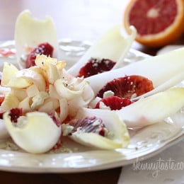 A simple salad made with endive lettuce, blood oranges, Gorgonzola with a blood orange vinaigrette.