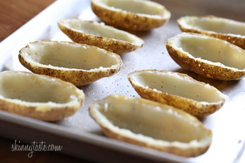 Baked potatoes scooped out on a sheet pan
