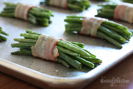 Pretty little bundles of bacon wrapped French "green beans" known as Haricot verts which are longer and thinner than the typical American green beans. Of course, American green beans will work just fine here too.