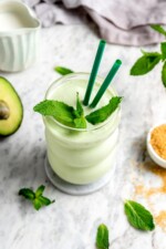 Shamrock shake copycat recipe in glass with sprig of fresh mint