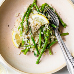 Creamy asparagus risotto, cooked with fresh herbs, Parmigiano-Reggiano and a touch of lemon. Perfect Spring meatless main dish or wonderful topped with grilled shrimp or scallops.