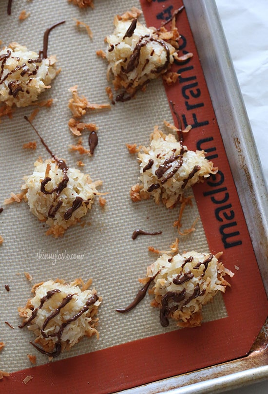 I took last year's plain coconut macaroons and drizzled them with a little chocolate to satisfy my craving. I reduced the sugar a little to compensate for the chocolate and drizzled some chocolate over them once they were done.