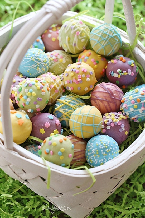 These Easter Egg cake balls are such a fun Easter dessert idea! Made lighter by using a box cake mix, egg whites and fat free Greek yogurt – no oil, no butter required!