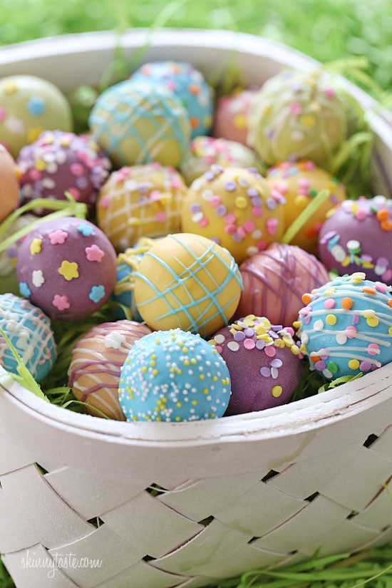 These Easter Egg cake balls are such a fun Easter dessert idea! Made lighter by using a box cake mix, egg whites and fat free Greek yogurt – no oil, no butter required!