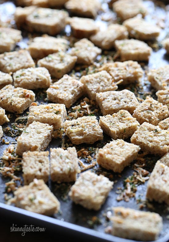 Healthier homemade croutons made with whole grain bread, Italian seasoning and shredded parmesan cheese.