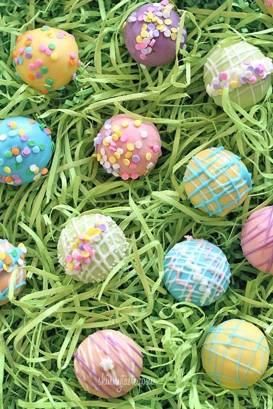 These Easter Egg cake balls are such a fun Easter dessert idea! Made lighter by using a box cake mix, egg whites and fat free Greek yogurt – no oil, no butter required!