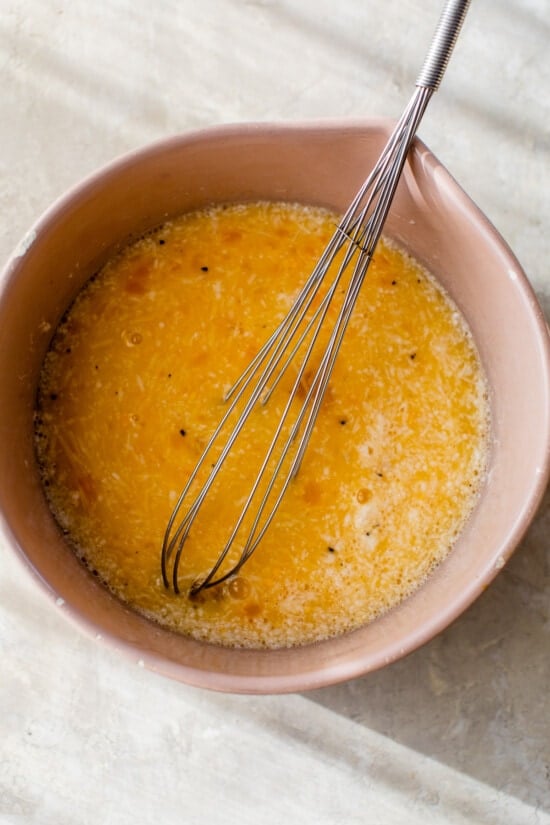 eggs in bowl with whisk