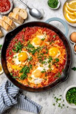 Overhead view of eggs in purgatory in skillet
