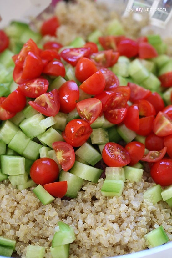 Add fresh vegetables to cooked quinoa.