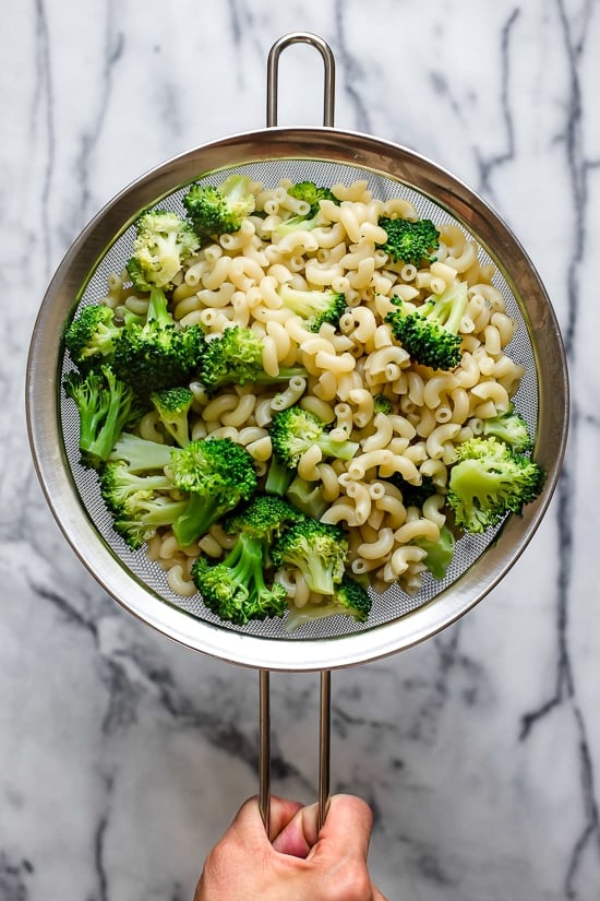 This homemade, lightened up baked mac and cheese recipe adds broccoli to the mix, a great way to sneak veggies in a kid's favorite dish!