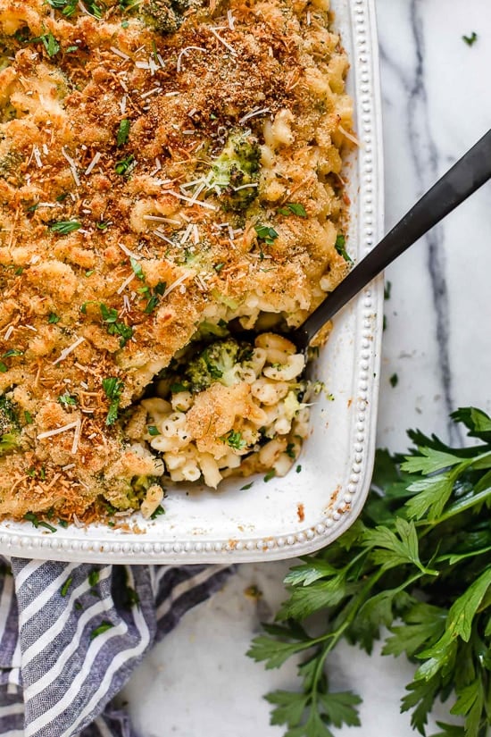 This homemade, lightened up baked mac and cheese recipe adds broccoli to the mix, a great way to sneak veggies in a kid's favorite dish!