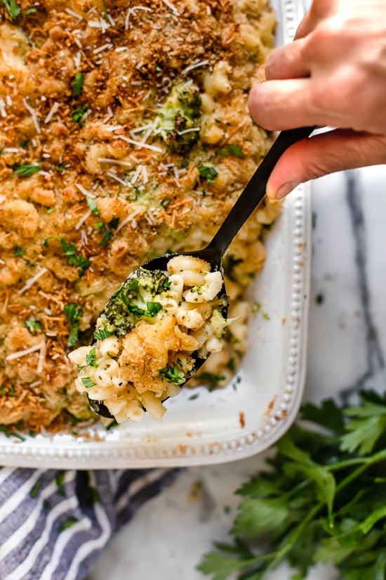 This easy, homemade, baked mac and cheese recipe adds broccoli to the mix, a great way to sneak veggies in a kid's favorite dish! It's also lightened up, so less calories than traditional mac and cheese.