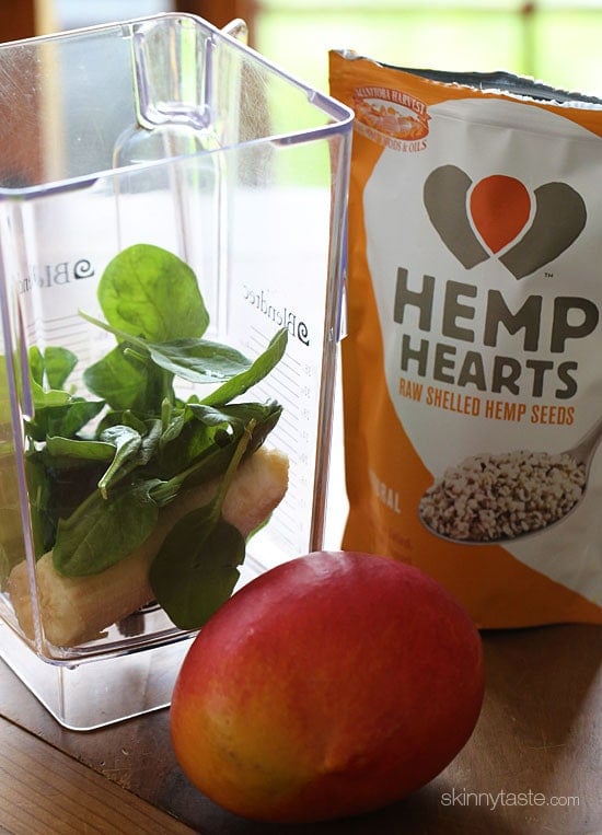 Start the morning RIGHT with this super delicious, creamy green smoothie made with frozen banana, baby spinach, fresh mango, hemp seeds and almond milk.