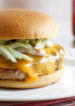 Turkey burgers with a cayenne pepper kick! Here's a fun way to turn boring turkey burgers into something with a little more exciting. If you're a buffalo wing fan, you'll love the flavors in this turkey burger topped with a broccoli slaw tossed with my very own homemade blue cheese dressing.