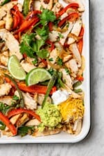 Overhead view of chicken fajitas in pan