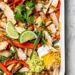 Overhead view of chicken fajitas in pan