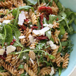 I love making this mayo-less summer pasta salad with arugula, spinach, sun dried tomatoes, capers, fresh shaved Parmesan cheese and a splash of balsamic and oil.