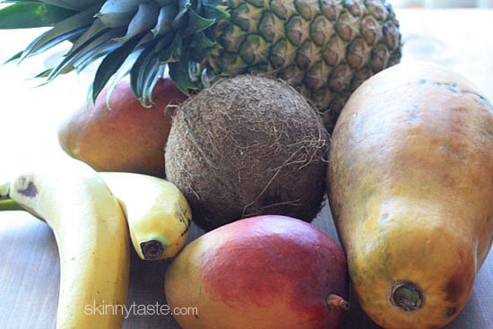 This tropical fruit salad, made with fresh papaya, mango, pineapple, bananas and grated coconut is the best tasting fruit salad... EVER!!