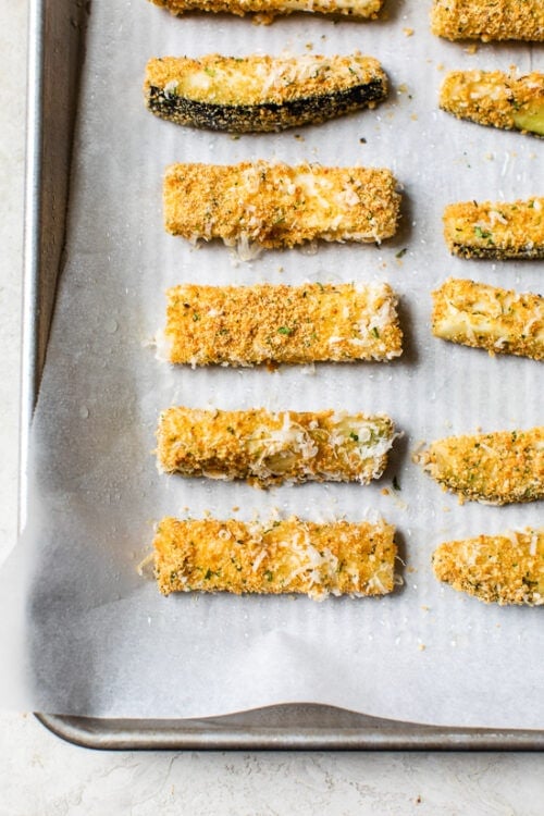 These Baked Eggplant Sticks are breaded with Italian breadcrumbs and Parmesan, baked or air-fried until golden, and served with a quick marinara sauce.