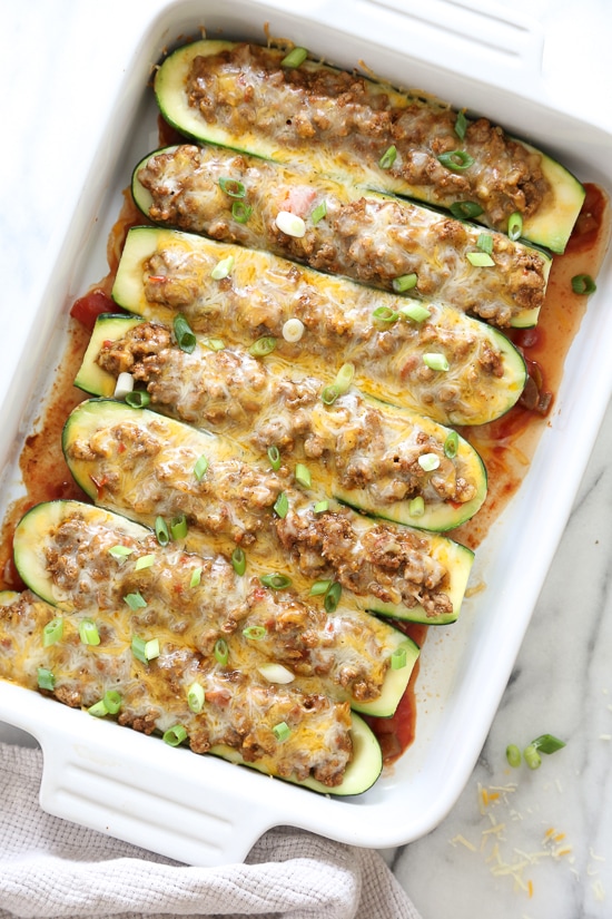 For a low-carb, summer spin on taco night, you'll love these Taco Stuffed Zucchini Boats filled with seasoned ground turkey and topped with a Mexican cheese blend.