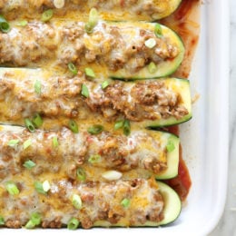 These low-carb stuffed turkey taco zucchini boats are so easy, a fun twist on taco night!