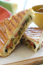 A perfect summer lunch panini made with eggplant, tomatoes, mozzarella and skinny pesto on crispy French bread. Make this for one, or for the whole family.