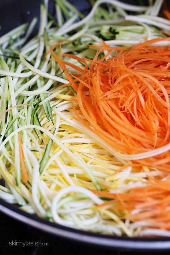 Zucchini, yellow squash and carrots cut into spaghetti like strands and sauteed with garlic and oil. I make this side dish ALL summer long – not just because it's low-carb, gluten-free, clean and paleo friendly, but because it's delicious, good for you and also happens to be my husband's favorite way to enjoy zucchini!
