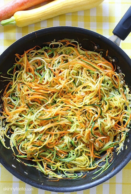 Zucchini, yellow squash and carrots cut into spaghetti like strands and sauteed with garlic and oil. I make this side dish ALL summer long – not just because it's low-carb, gluten-free, clean and paleo friendly, but because it's delicious, good for you and also happens to be my husband's favorite way to enjoy zucchini!