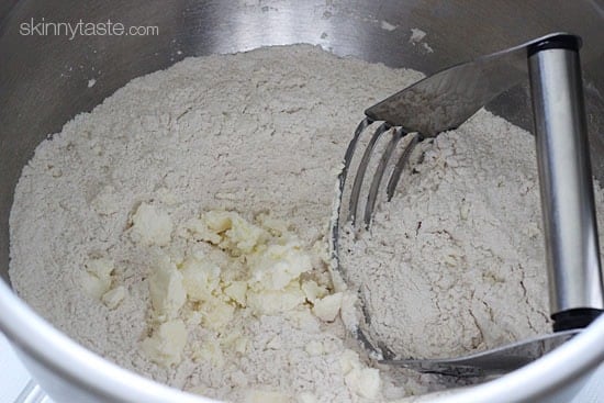 Light and biscuit-like savory scones made with a blend of whole wheat and white flour, shredded zucchini, sun dried tomato, Asiago cheese and fresh rosemary.